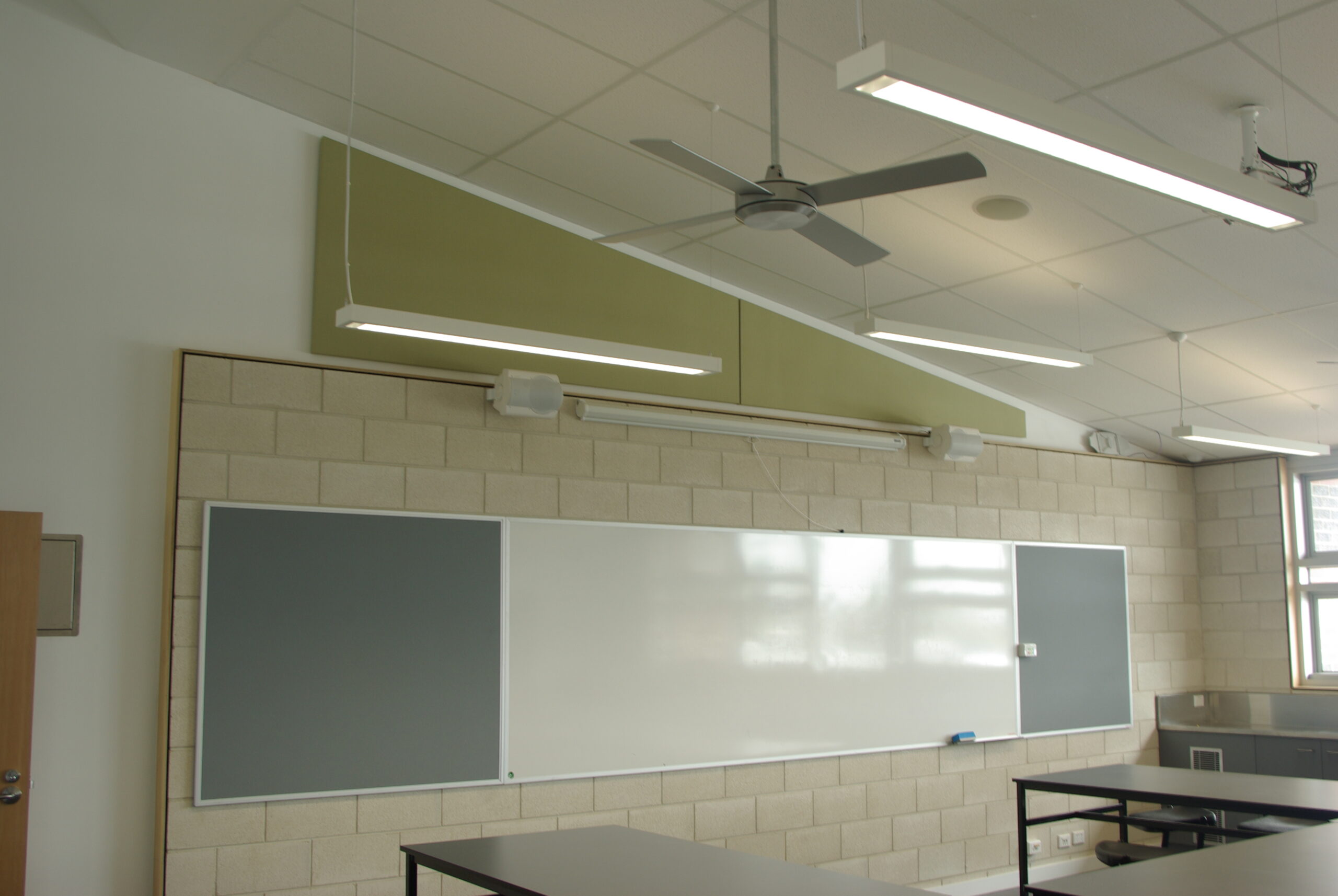 Lightweight SerenityLite Acoustic Ceiling Panels suspended to reduce echo and reverberation.