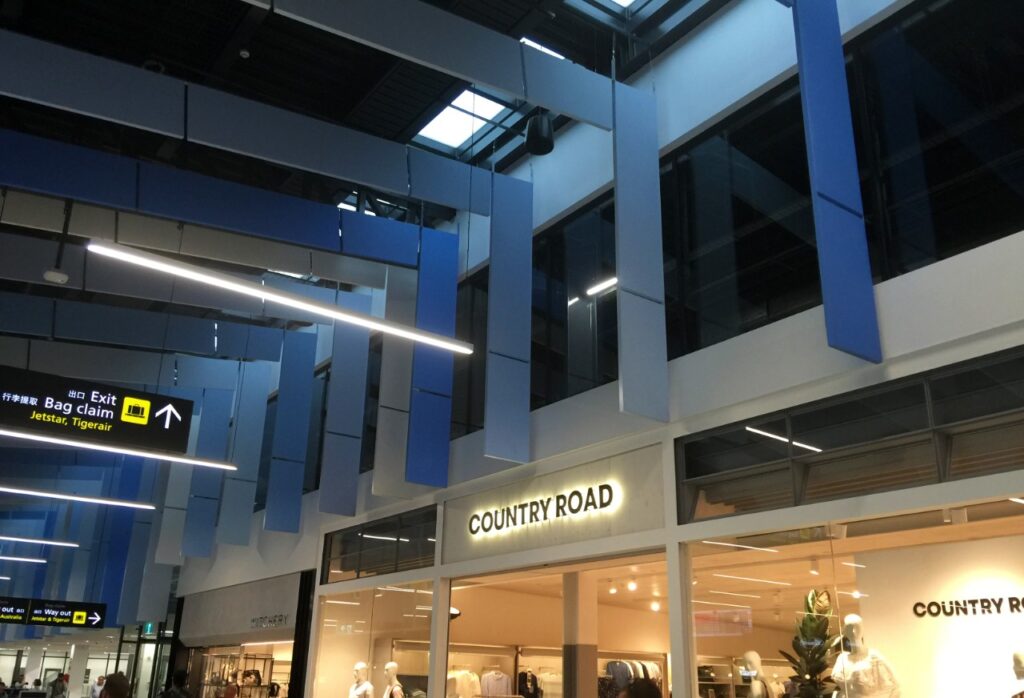 What are acoustic baffles and how can they improve sound quality in large spaces?