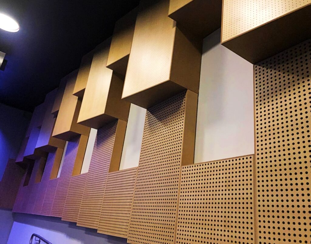 Perforated Murano Acoustic Timber Panels used as deep bass traps in a recording studio for low-frequency sound control.