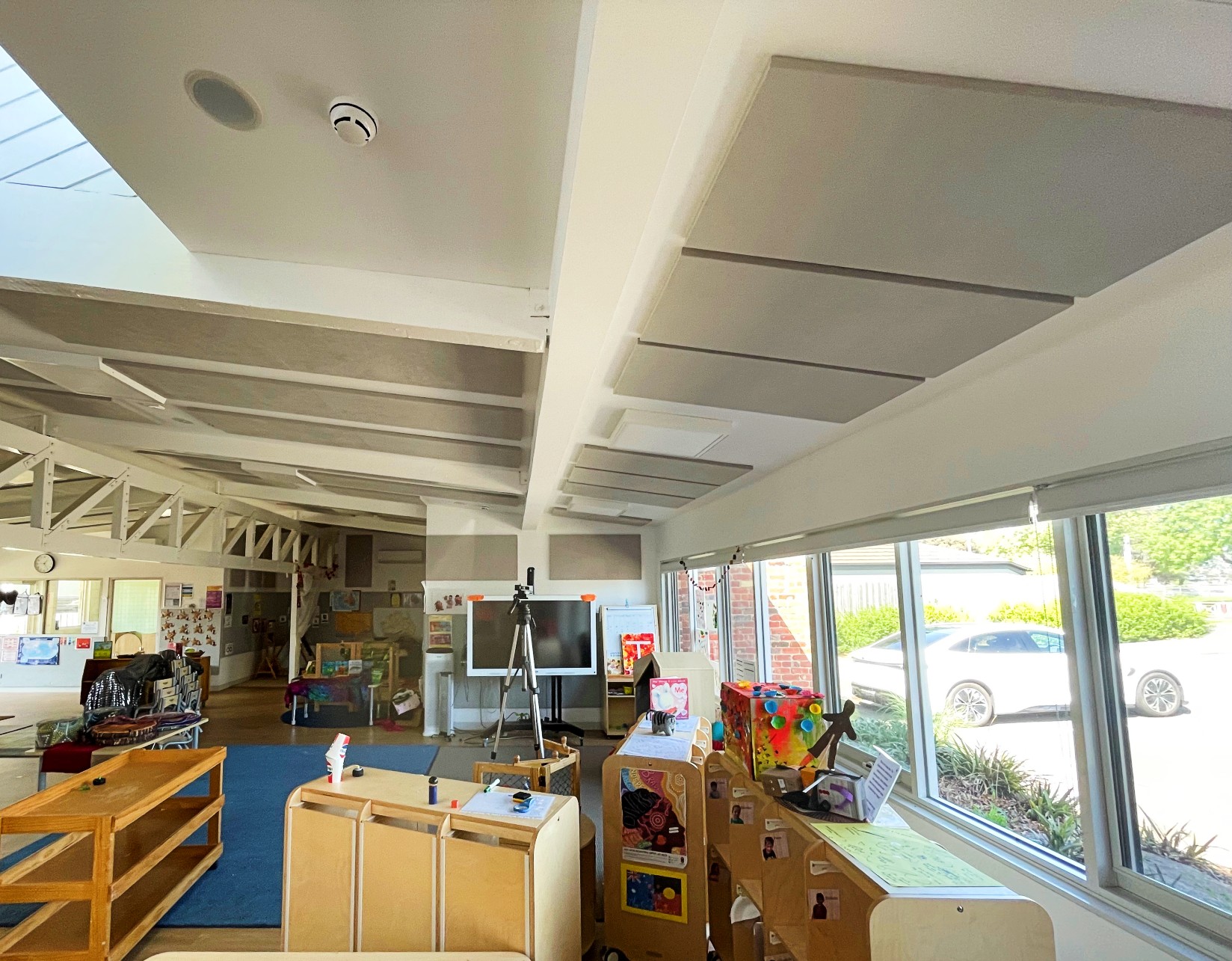Lightweight SerenityLite Acoustic Ceiling Panels suspended to reduce echo and reverberation.