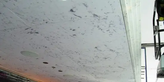 Printed acoustic ceiling panels with a marble finish, combining aesthetic appeal with sound absorption for commercial interiors.