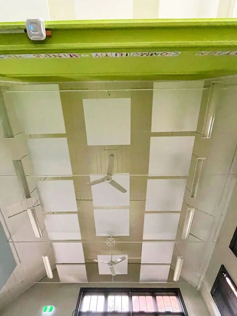 Lightweight SerenityLite Acoustic Ceiling Panels suspended to reduce echo and reverberation.