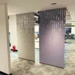 Office screens. Decrasound acoustic hanging screen installed in an open office space