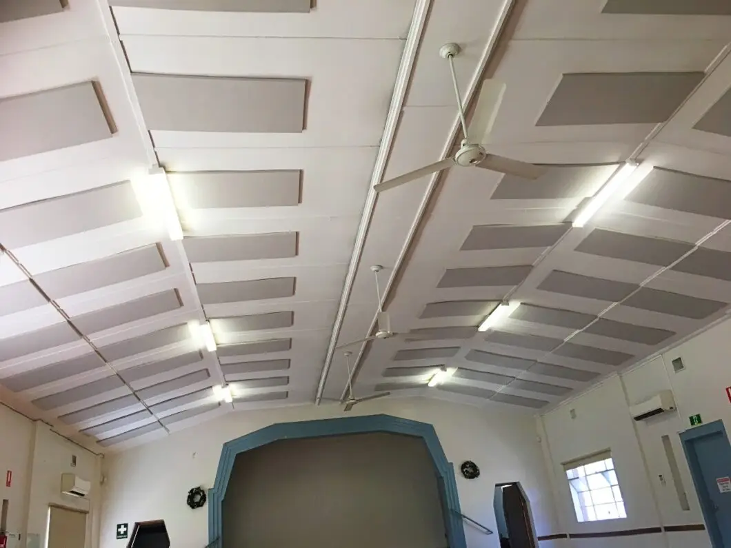 Ceiling-mounted Serenity Acoustic Panels installed in a community hall to reduce echo and improve sound clarity during events and gatherings.
