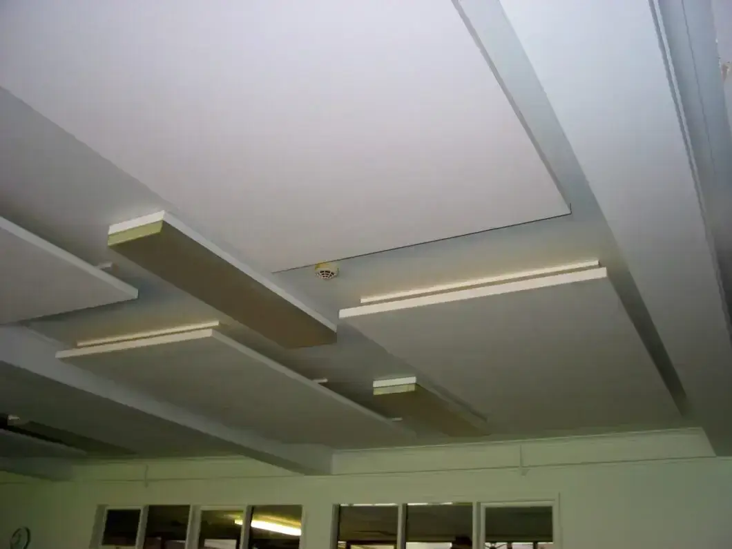 Lightweight SerenityLite Acoustic Ceiling Panels suspended to reduce echo and reverberation.
