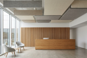 Acoustic ceiling panels in office reception area reducing noise and echoontext