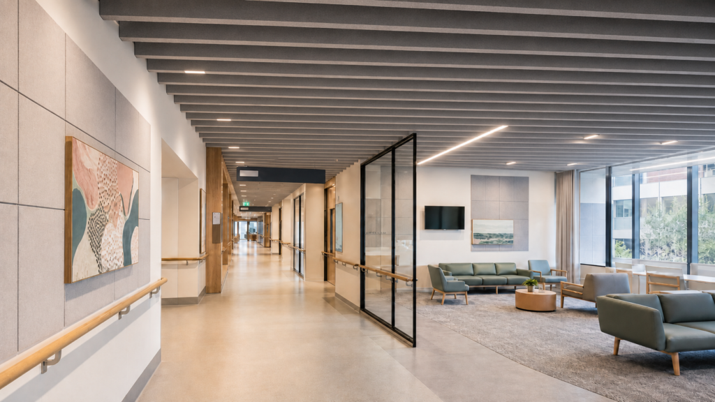 Decrabaffles acoustic ceiling baffles installed in a modern hospital corridor and waiting area to improve sound absorption and healthcare acoustic comfort